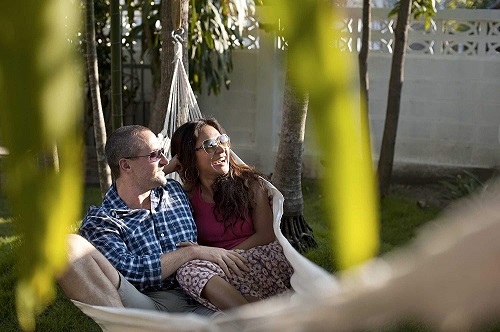 couple lounging in soft cotton hammock